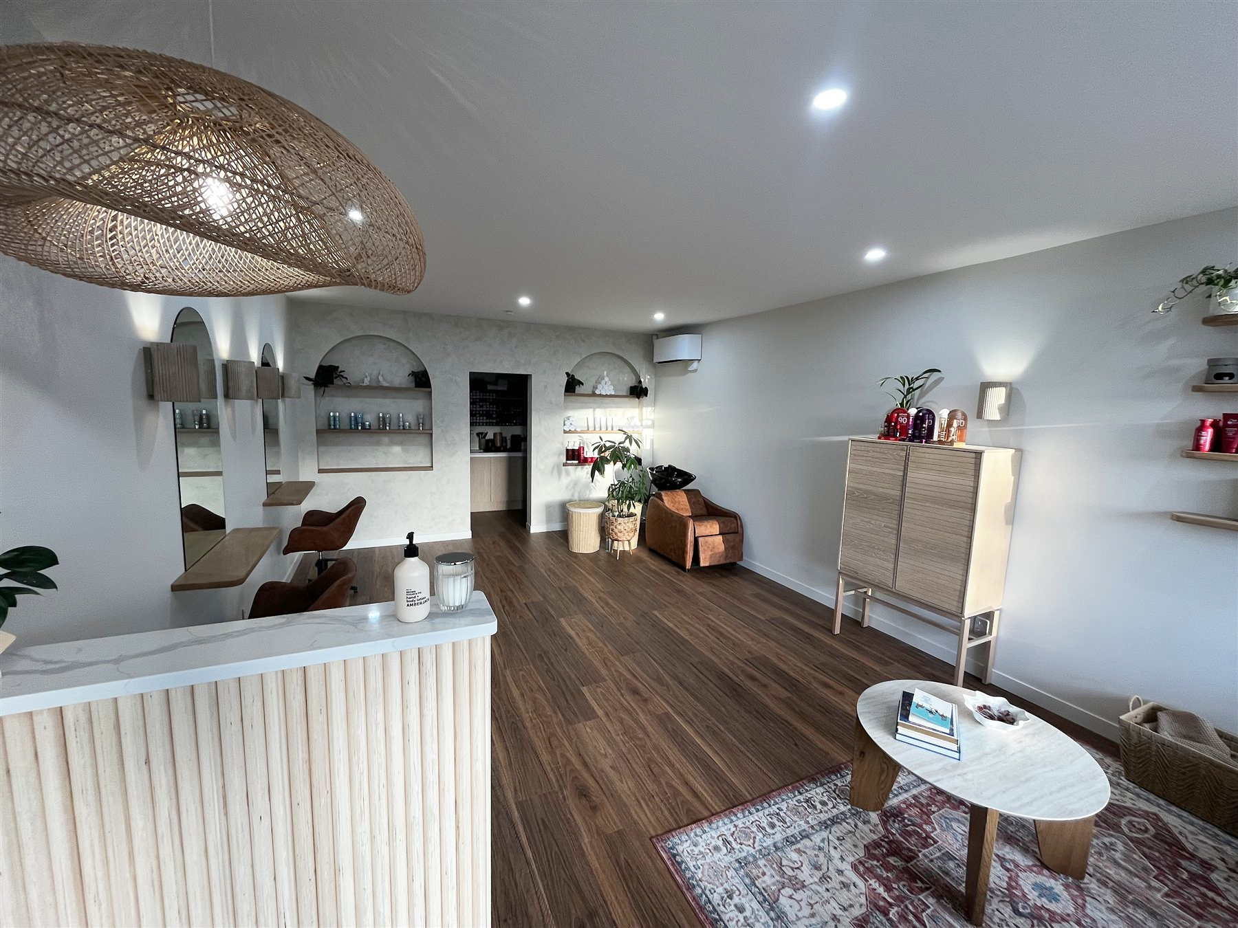 Flux salon fitout with timber joinery and warm interior finishes