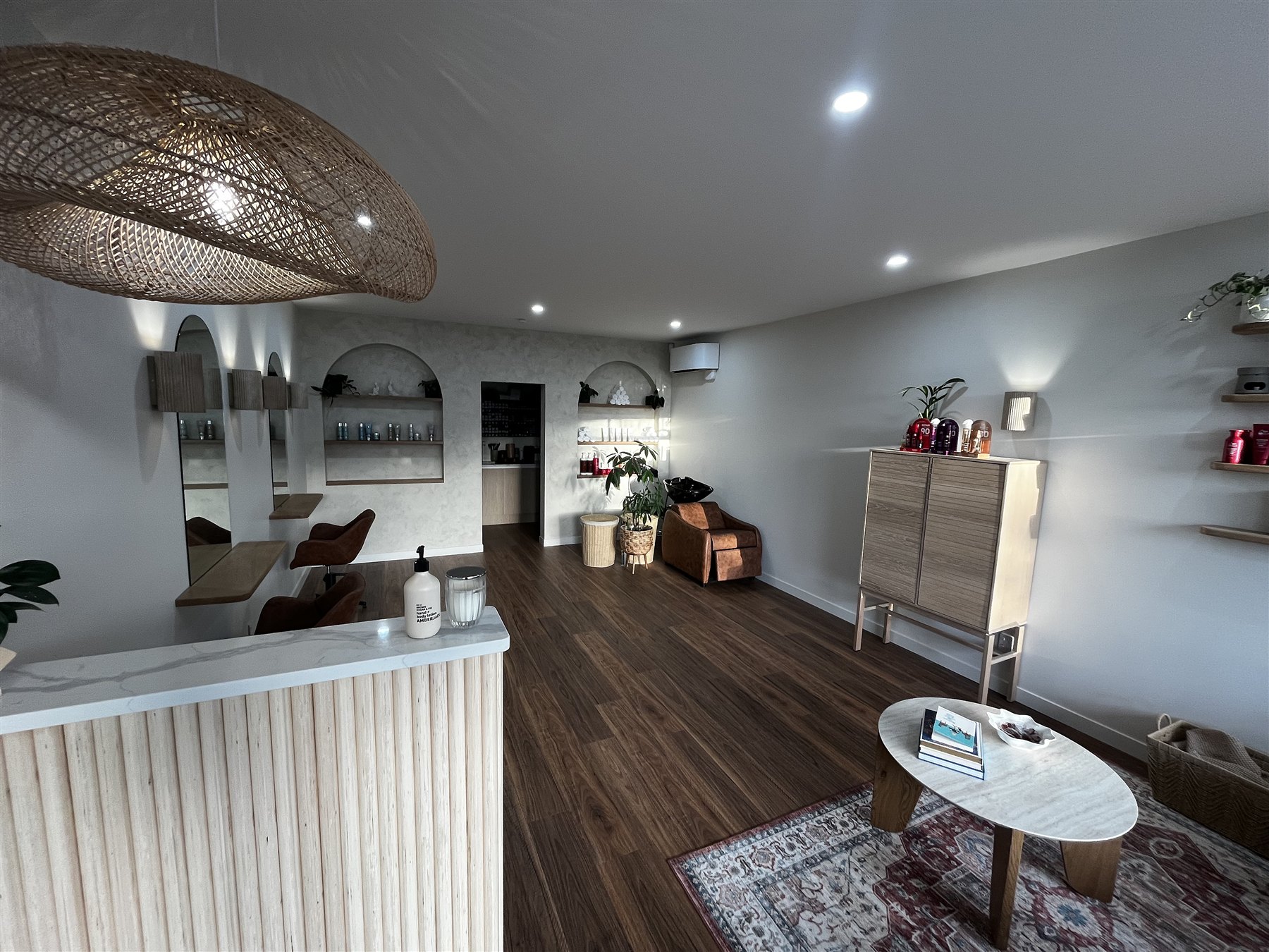 Flux salon fitout with timber joinery and warm interior finishes